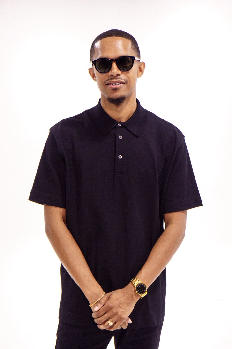 DJ BRE in Paid Jungle apparel inside a professional music studio