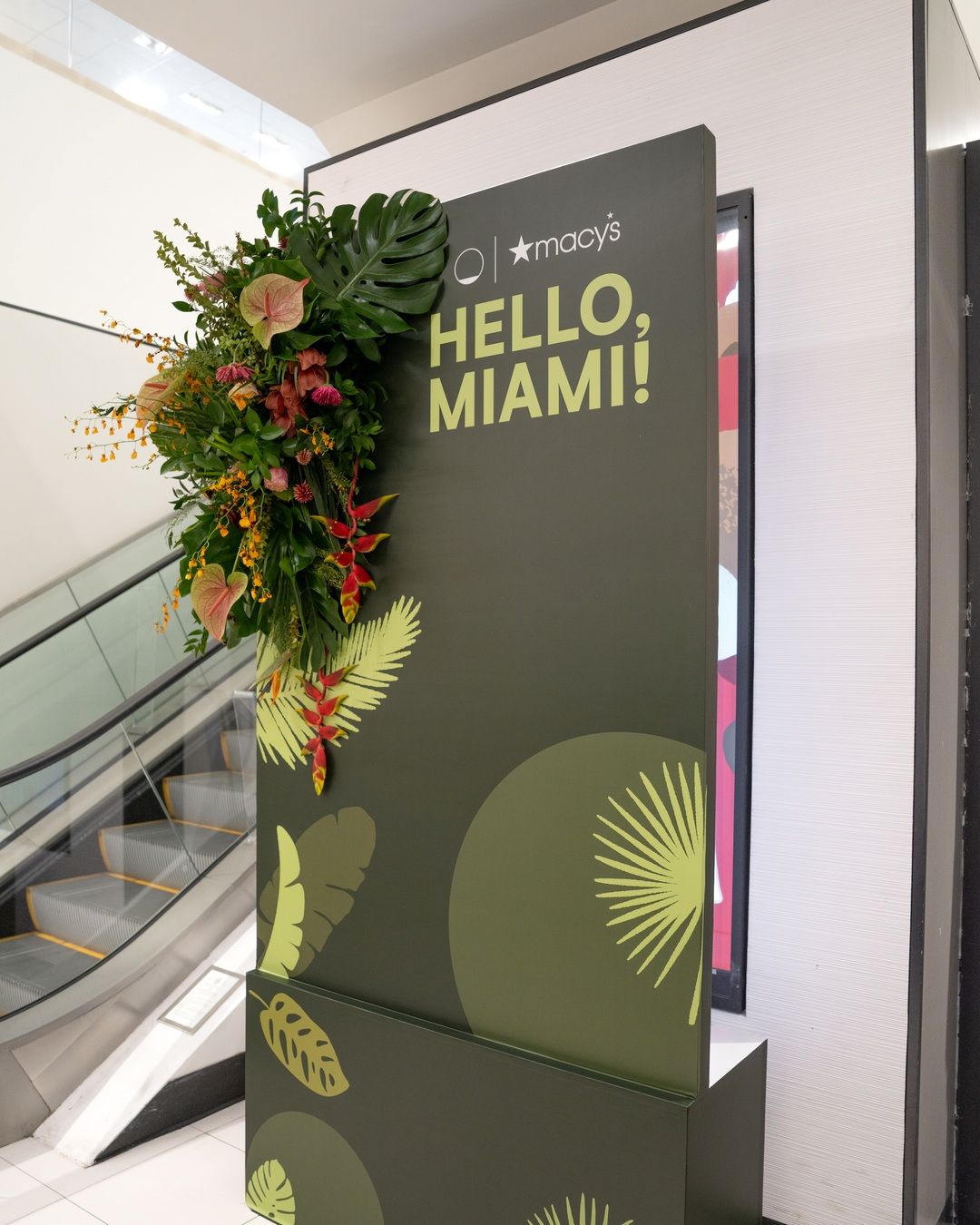 HELLO, MIAMI! brand activation wall with tropical florals at Macy's Aventura
